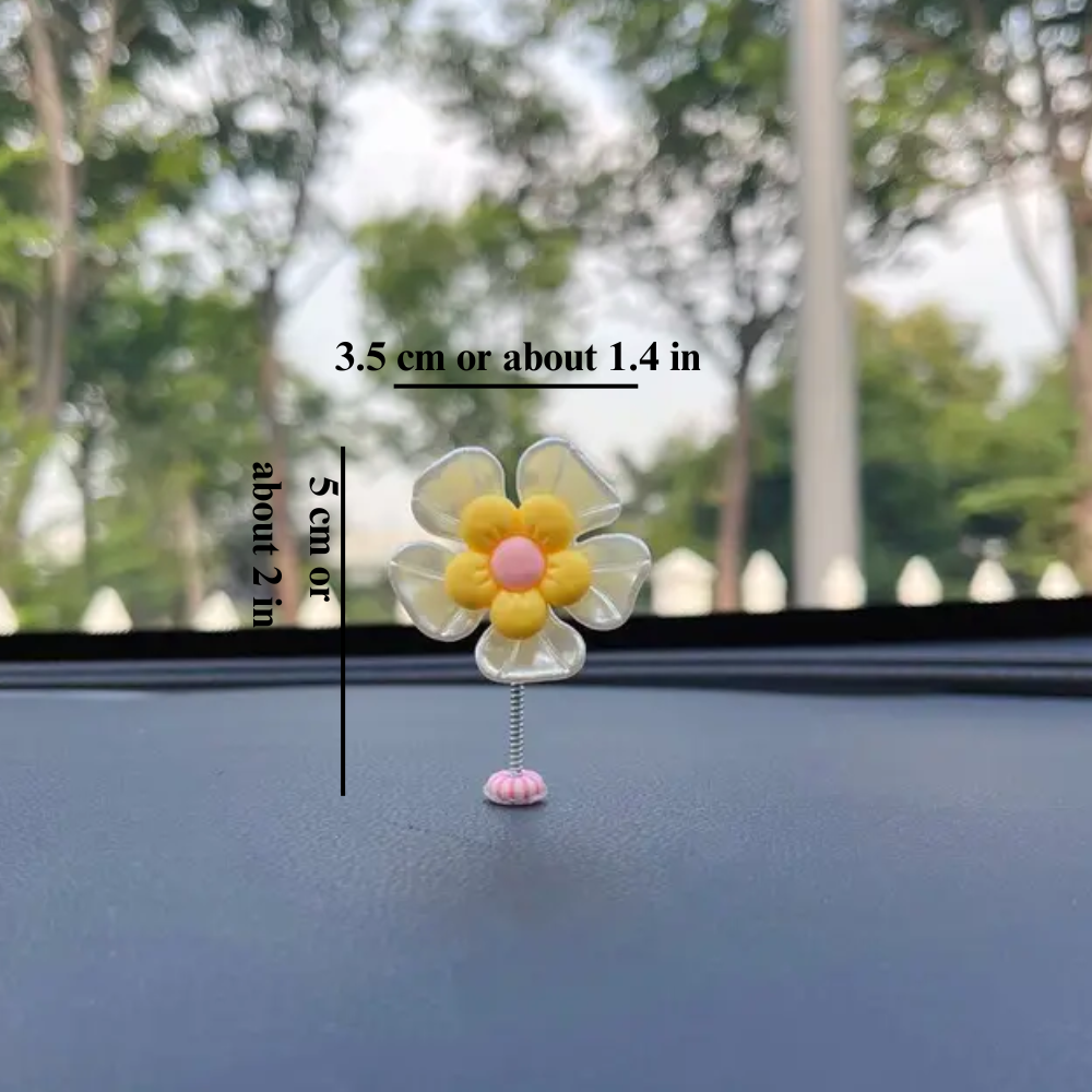 Slinger van margrietjes voor in de auto