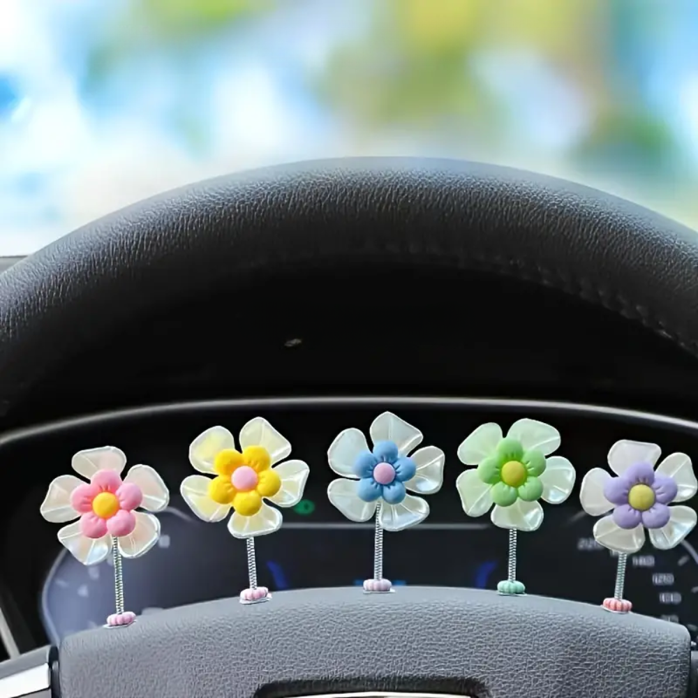 Slinger van margrietjes voor in de auto